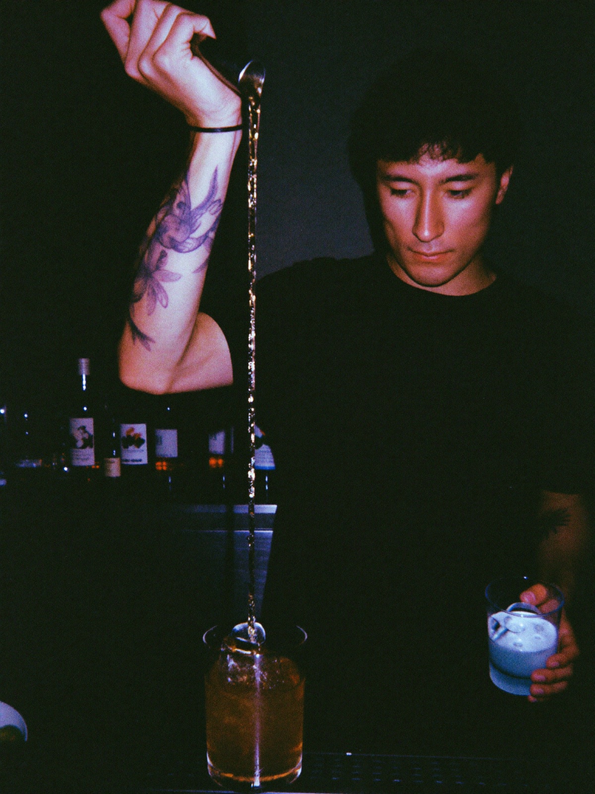 Bartender mid-pour